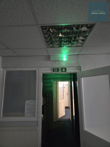 Illuminated emergency exit sign